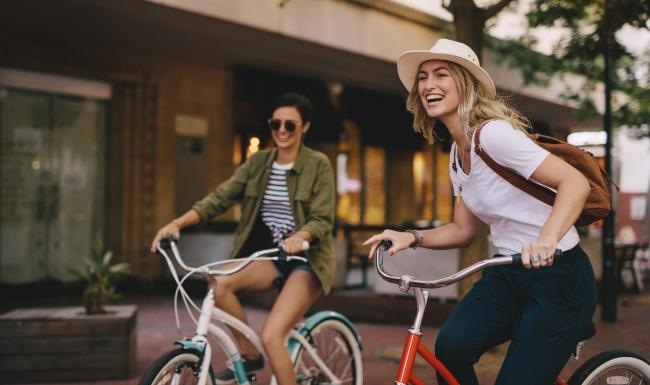 two woman riding bikes