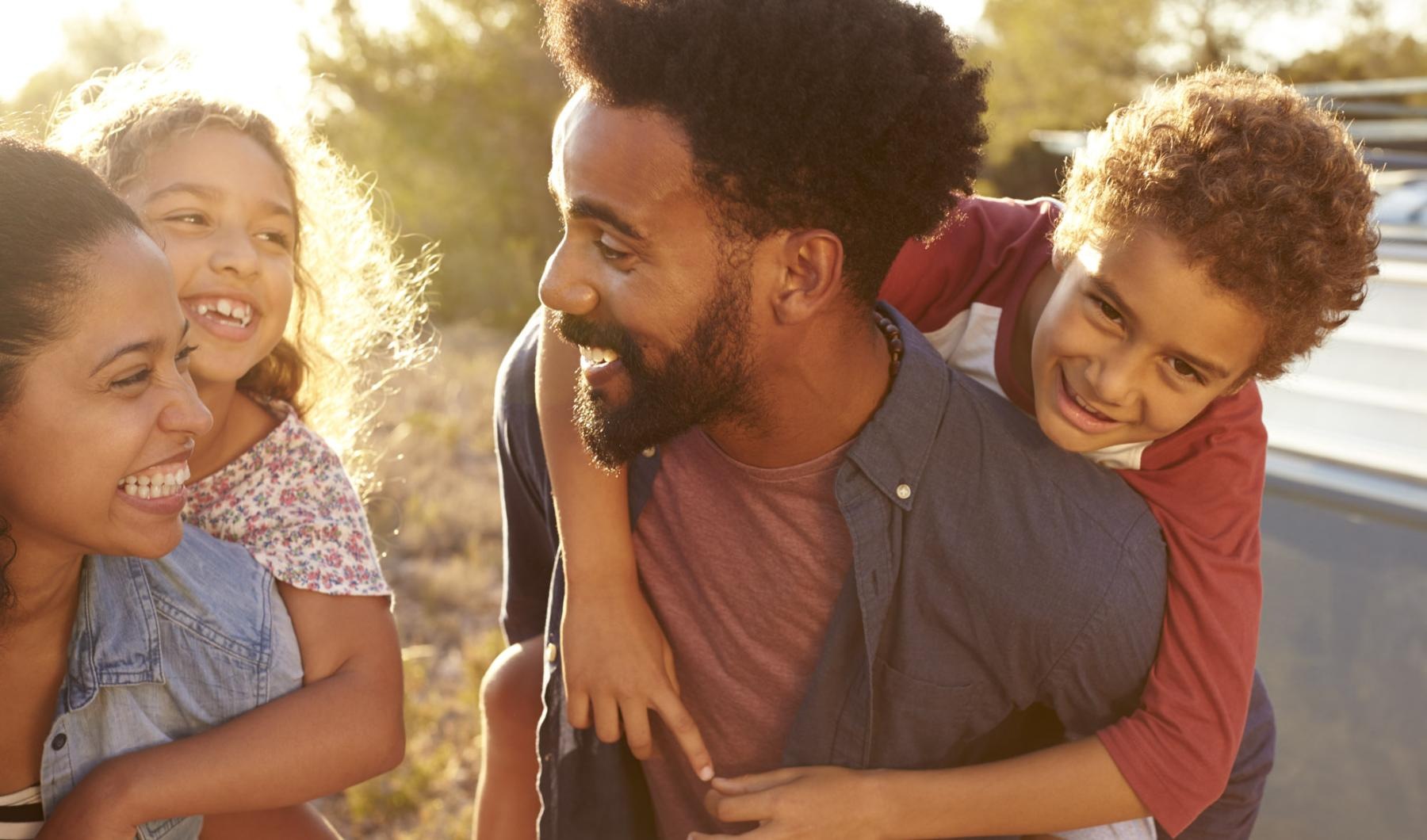 Find your perfect fit at Charleston Row a person holding a couple of children