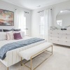 Bedroom with modern décor at Charleston Row townhomes for rent in Charlotte, NC